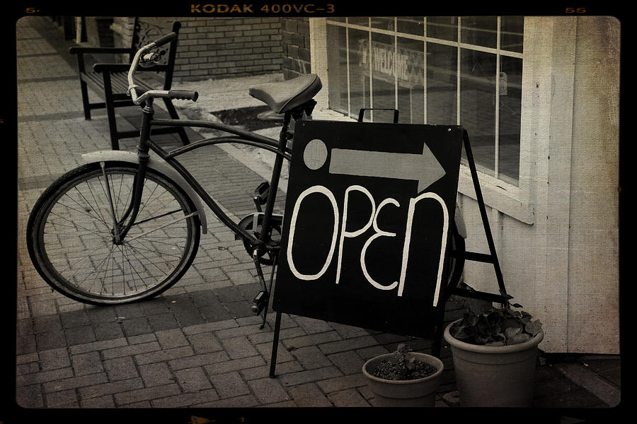 Vintage bicycle invites shoppers Photograph by Toni Hopper