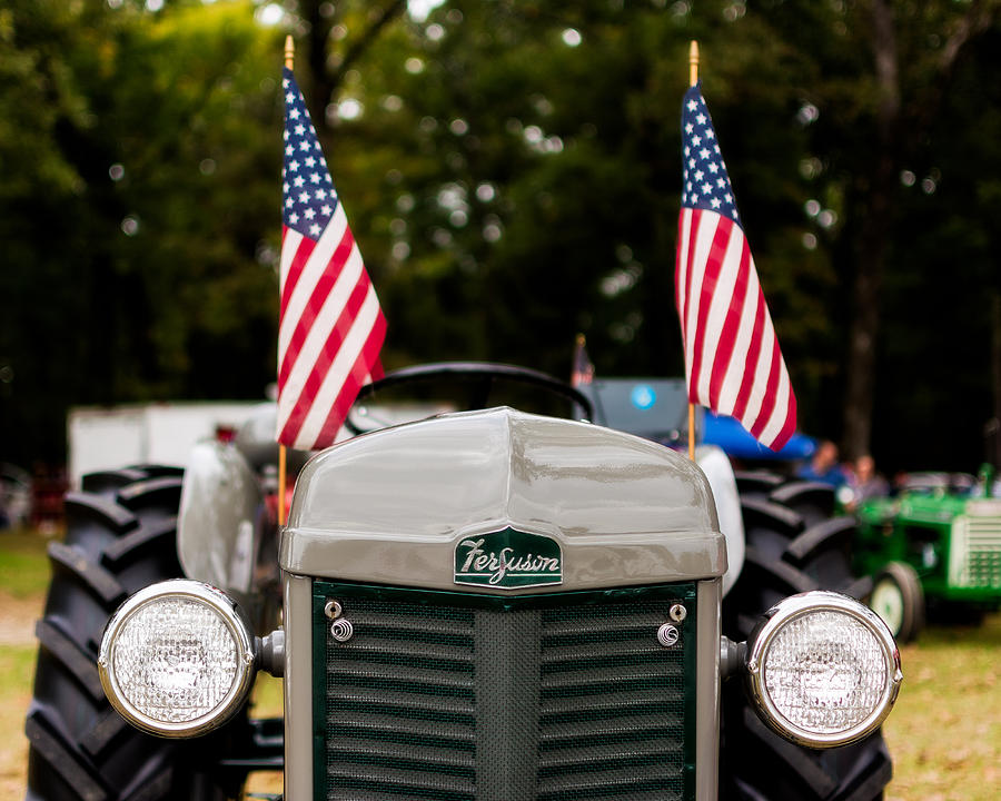 Flag Photograph - Vintage Ferguson Tractor with American Flags by Jon Woodhams