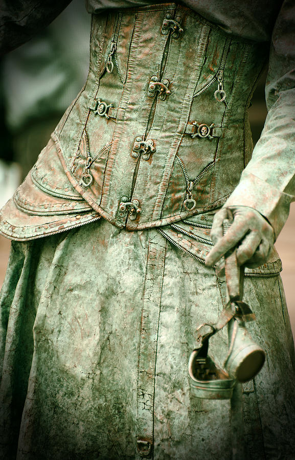 Close up of detailed steampunk dress hand holding a pair of googles Photograph by Jaroslaw Blaminsky