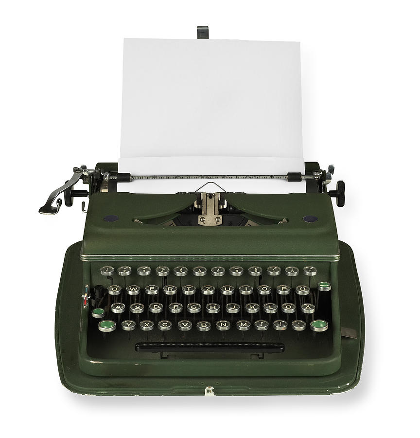 Vintage, green typewriter with paper on white background Photograph by Rolfbodmer