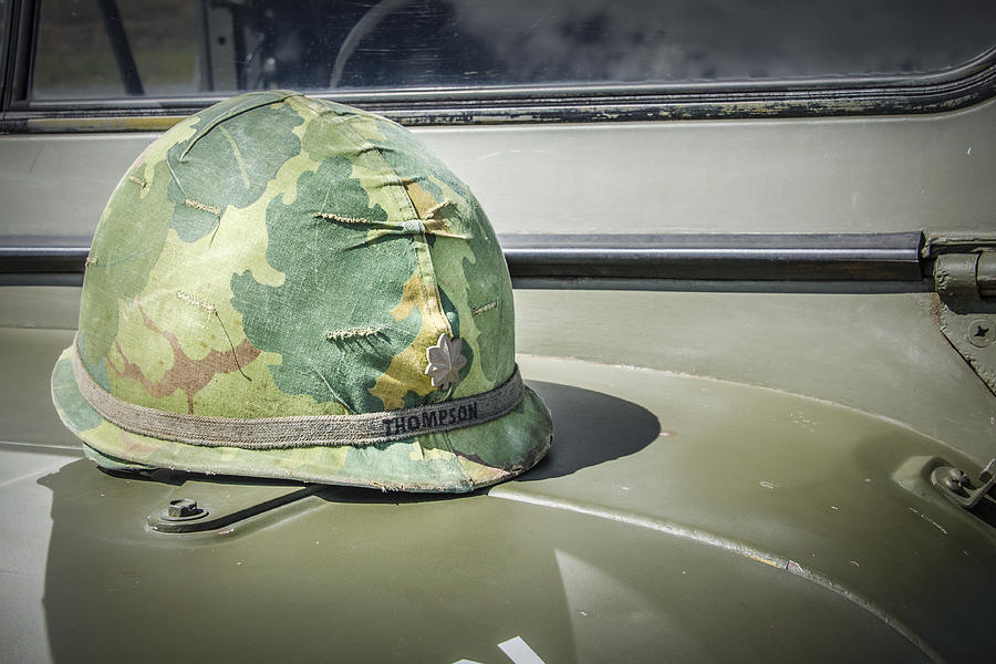 Vintage Helmet on Jeep Hood Photograph by Bradley Clay