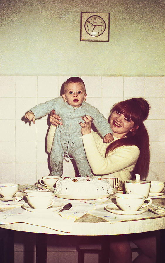 Vintage mommy and baby in the kitchen Photograph by Shanina