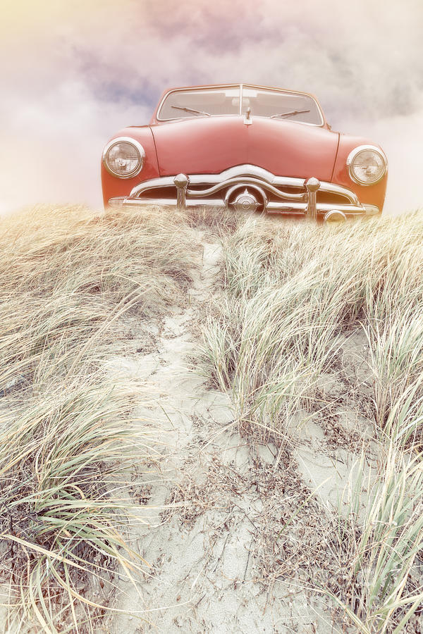Vintage red car in the sand dunes Photograph by Edward Fielding
