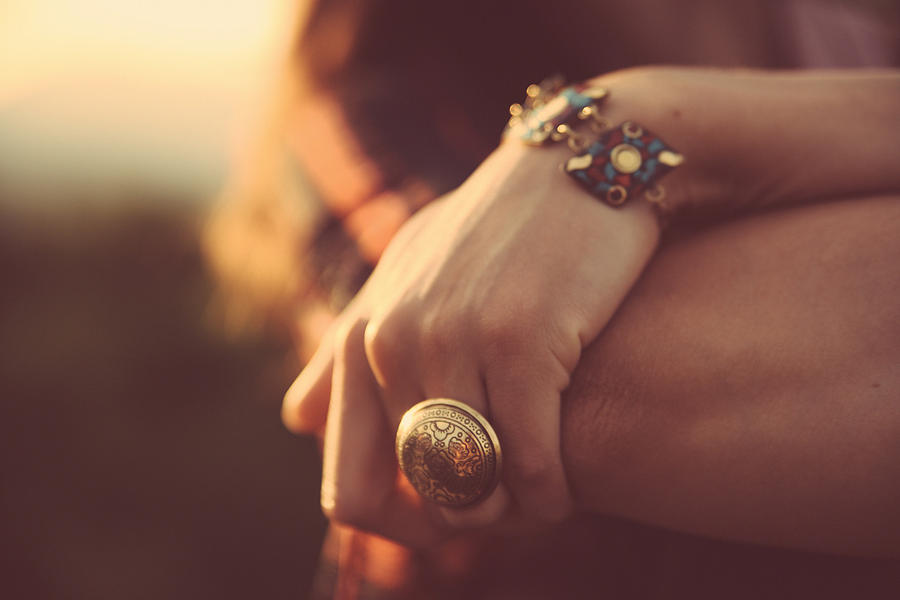 Vintage toned cross processed hand with jewelry Photograph by Lechatnoir