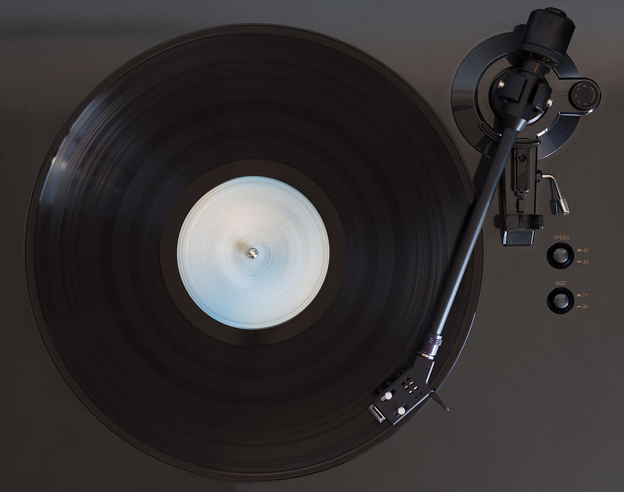 Vinyl record played on a turntable Photograph by Victor Cardoner
