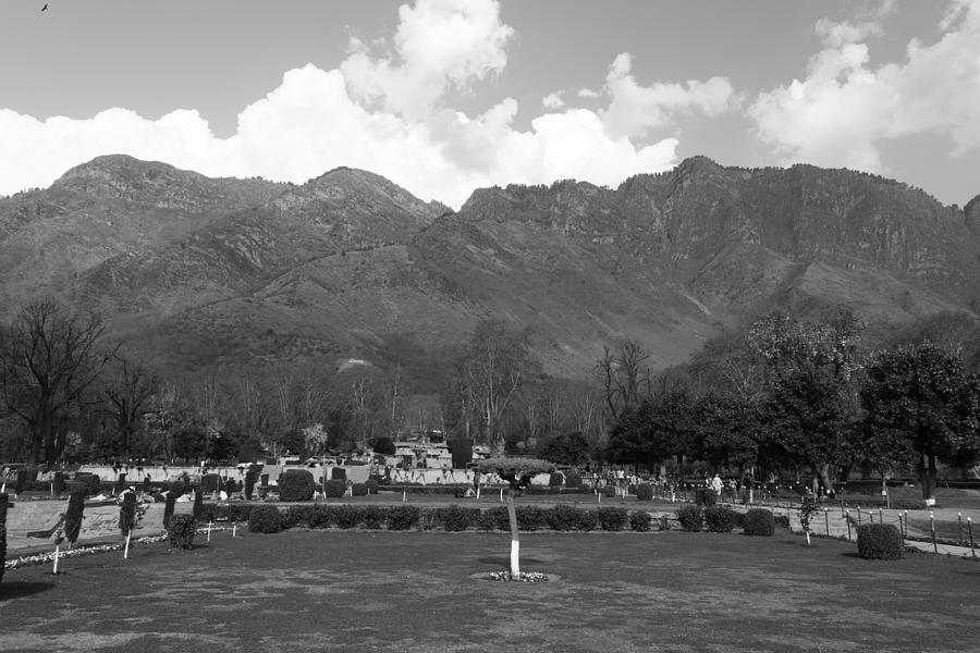 Visitors inside the Shalimar Garden with the backdrop of mountains Digital Art by Ashish Agarwal