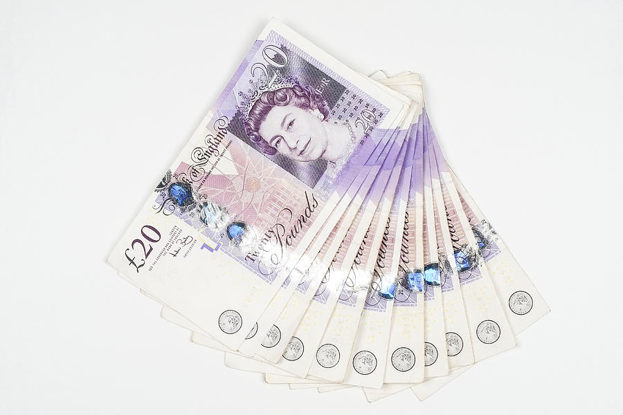 Wad of UK twenty pound notes Photograph by Clubfoto