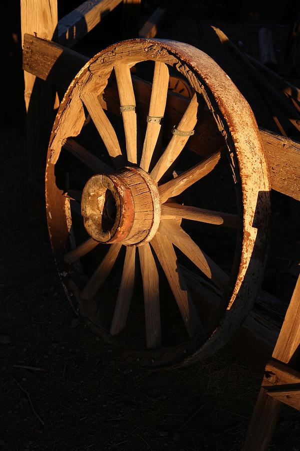 Wagon wheel at Sundown Photograph by Michael Hope