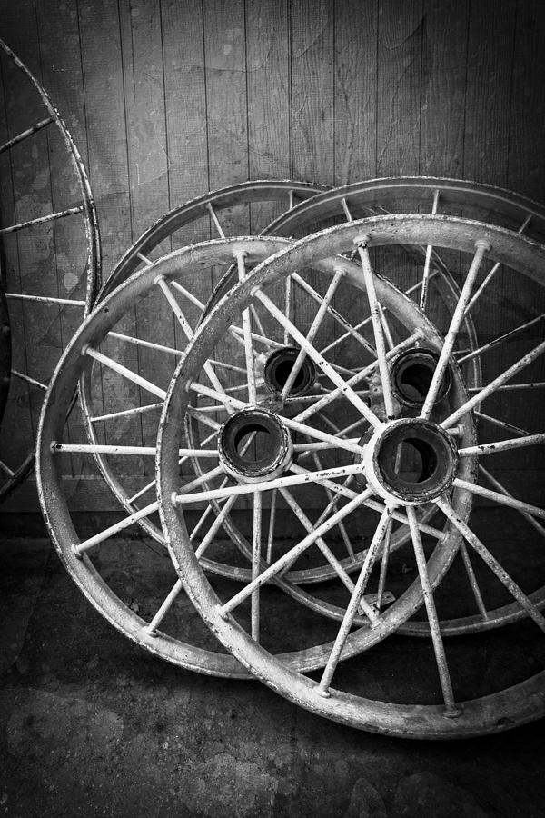 Barn Photograph - Wagon Wheels in Black and White by Debra and Dave Vanderlaan