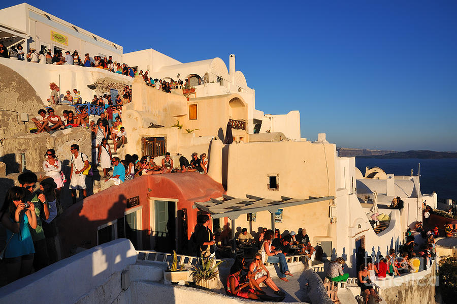 Greek Photograph - Waiting for the sunset in Oia town #1 by George Atsametakis