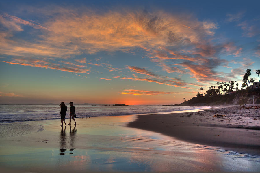 Walk along the Beach Photograph by Cliff Wassmann