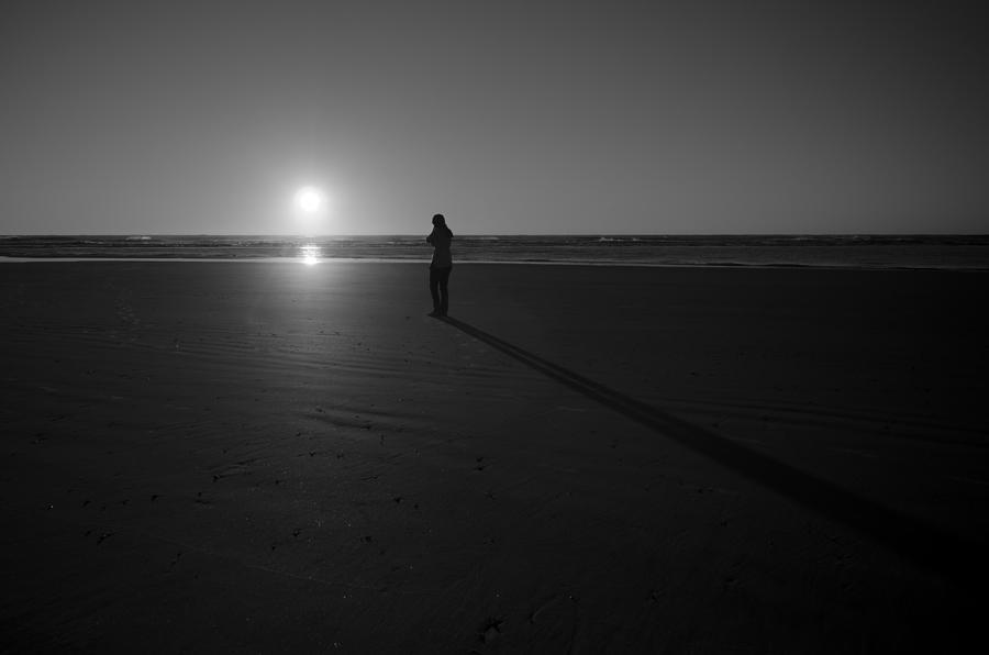 Walking on the Beach in Black and White Photograph by Anthony Doudt