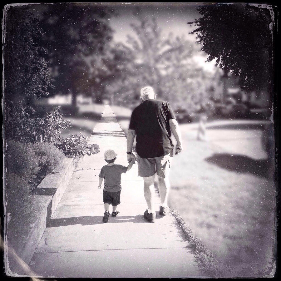 Walking with Grandpa Photograph by Natasha Marco