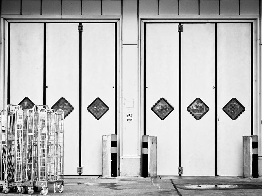 Architecture Photograph - Warehouse doors by Tom Gowanlock