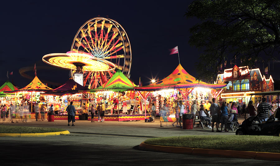 Warm summer night at the carnival Photograph by Timhughes