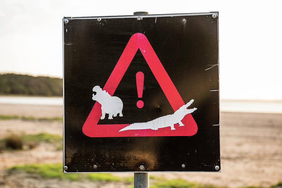 Warning Sign On The Shores Of Lake St Lucia Photograph by Peter Chadwick/science Photo Library