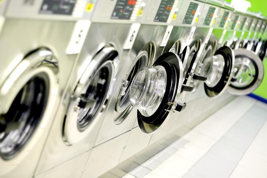 Washing machines in a public launderette Photograph by Deepblue4you