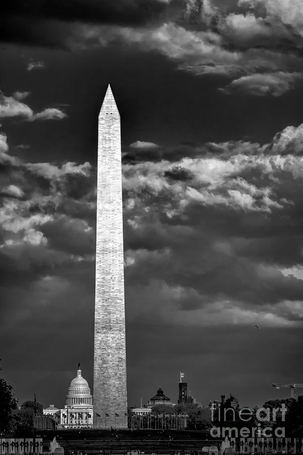 Washington Monument in cloudy sky Photograph by Izet Kapetanovic