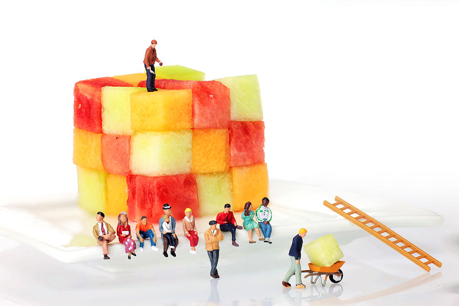 Watching fruit construction little people on food Photograph by Paul Ge