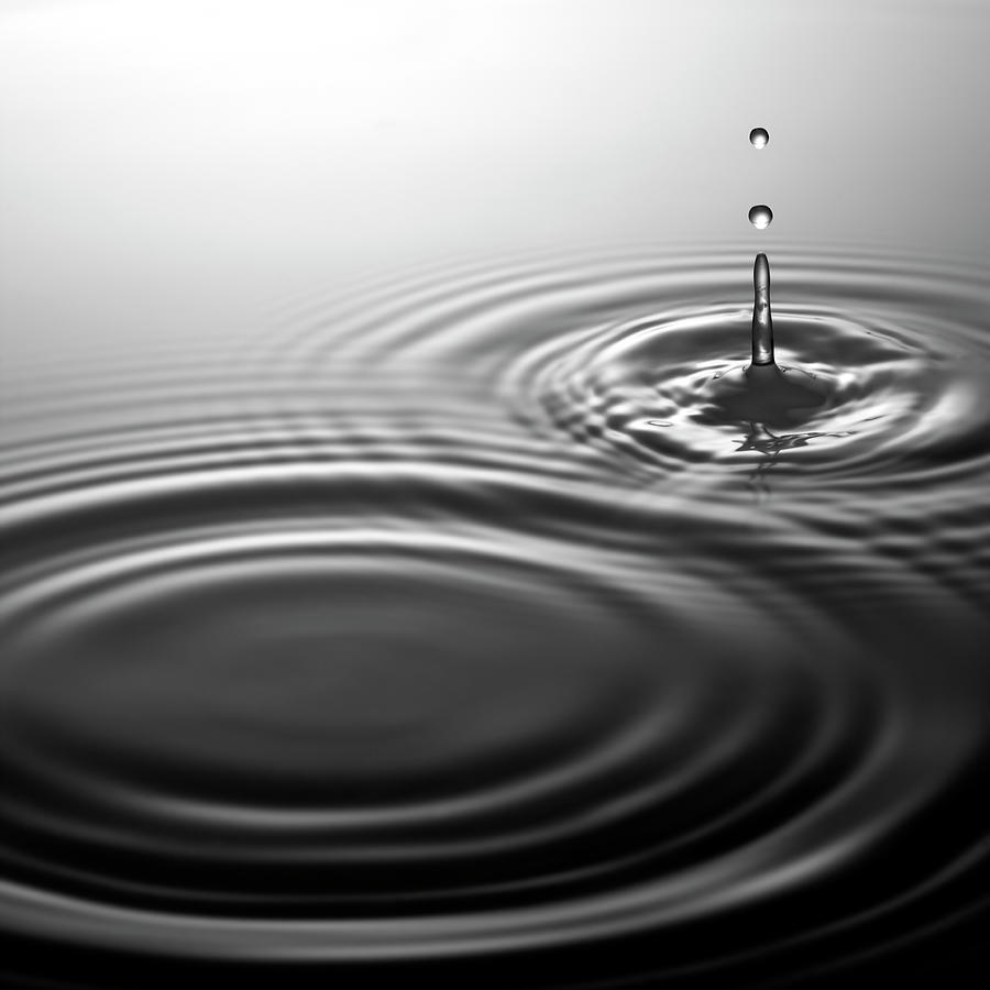 Water Drip Falling Onto Rippling Surface Photograph by Anthony Bradshaw