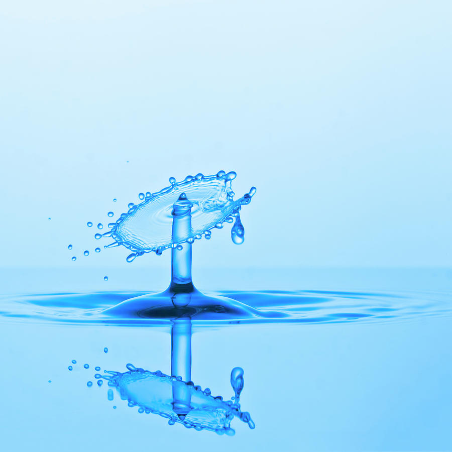 Water Drop Collision And Ripples, Blue Photograph by Kim Westerskov
