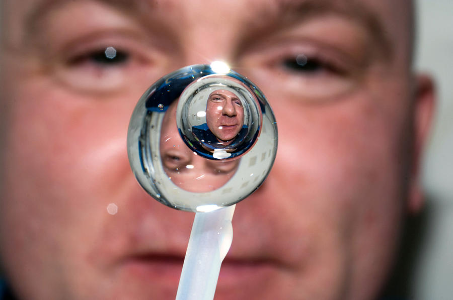 Water Droplet On The Iss Photograph by Science Source