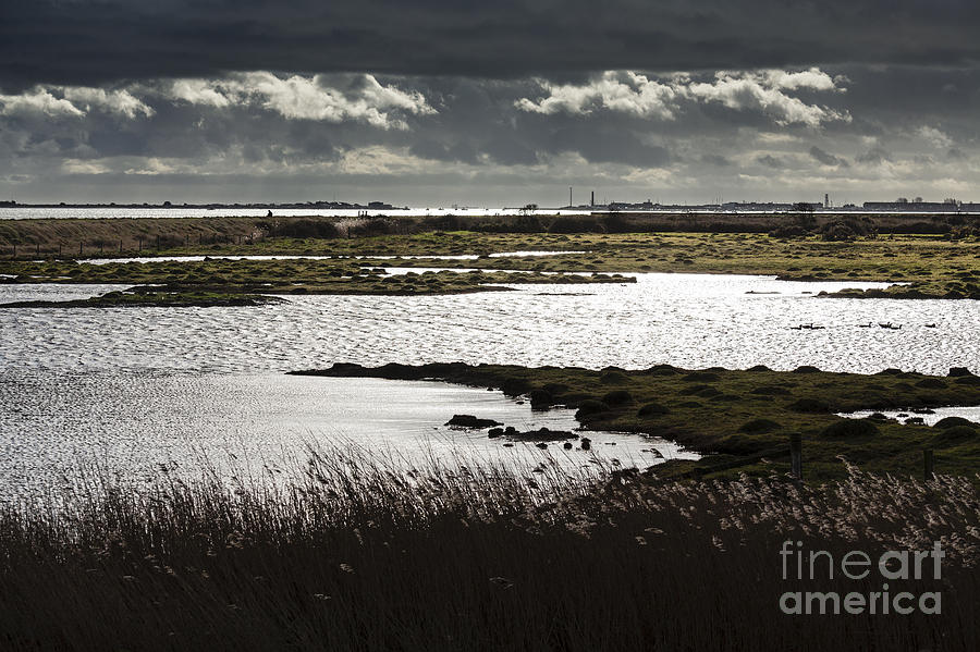 Water Reflection Storm Clouds At Farlington Marshes Wetlands Photograph by Peter Noyce