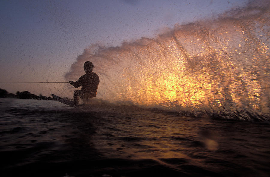 Water Skier Riding Low To Create Spray Photograph by Joel Sheagren