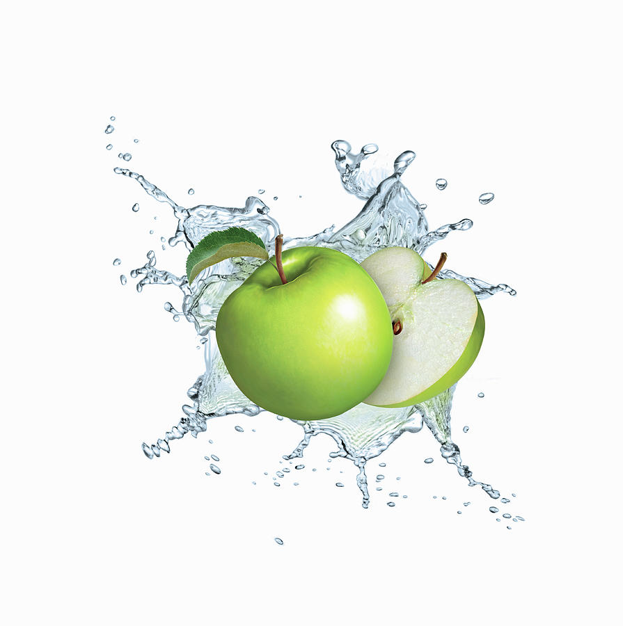 Water Splashing Around Green Apples Photograph by Ikon Ikon Images