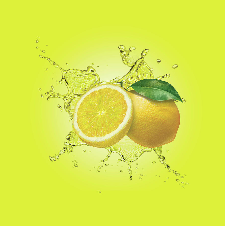 Water Splashing Around Lemons Photograph by Ikon Ikon Images