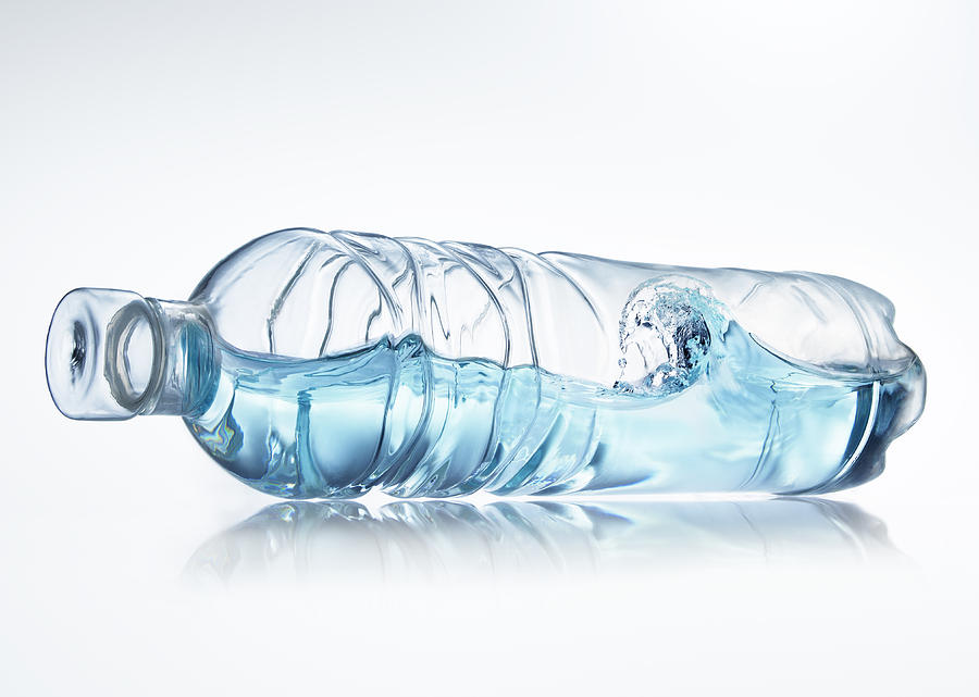 Water wave in bottle on white background Photograph by Biwa Studio