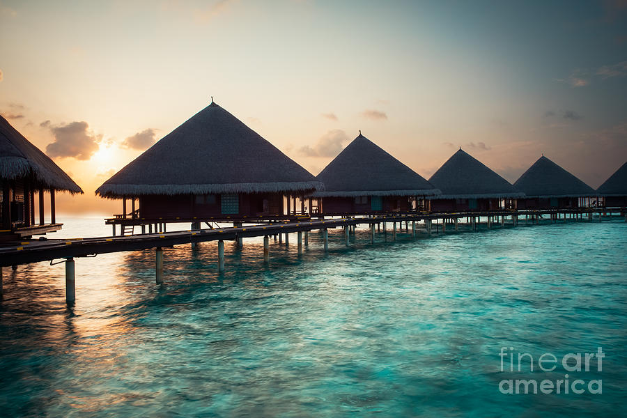 Waterbungalows At Sunset Photograph by Hannes Cmarits