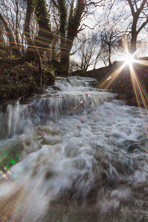 Winter Photograph - Waterfall with lens flare by Izzy Standbridge