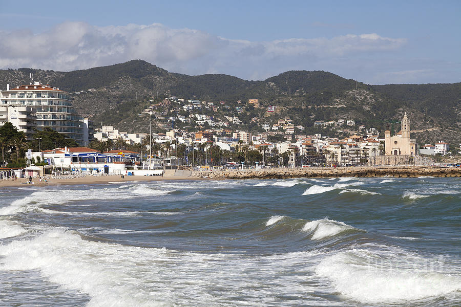 waves breaking on the sea front at Sitges Photograph by Peter Noyce