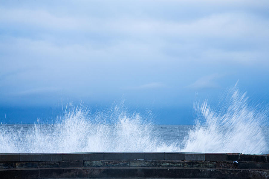 Waves crashing over seawall in Scarborough Photograph by Ian Middleton