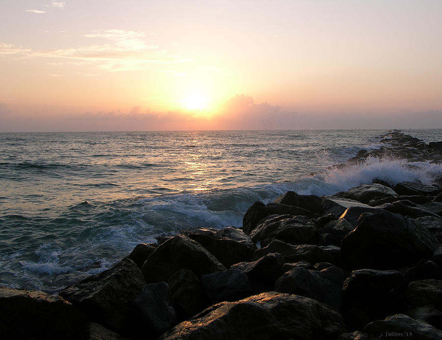Waves on the jetty at sunrise Photograph by Julianne Felton