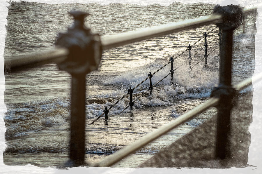 Waves through the railings Photograph by Spikey Mouse Photography