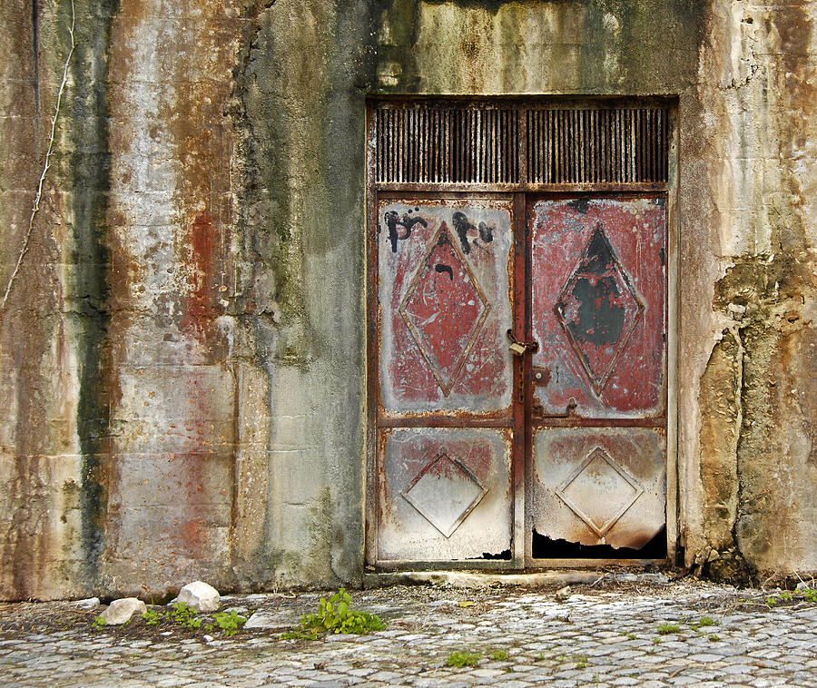 Weathered Metal Door and Stone Wall Photograph by Claudio Bacinello