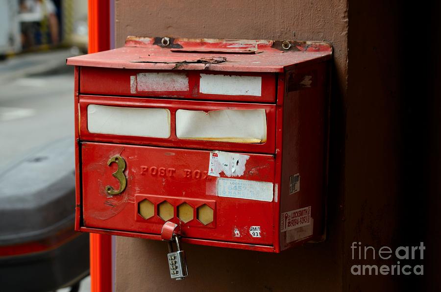 Singapore Photograph - Weathered red post box on pillar with combination lock Singapore by Imran Ahmed