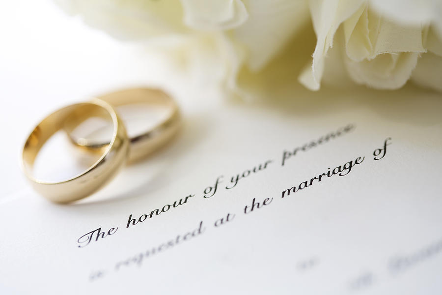 Wedding invitation and rings Photograph by Davidf