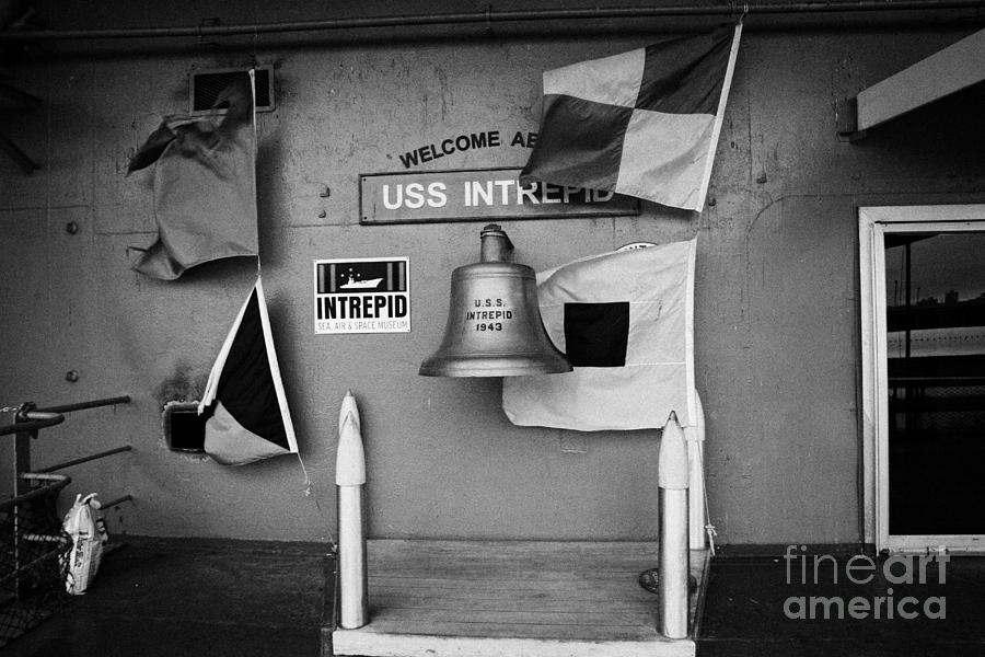 Winter Photograph - Welcome aboard sign flags and USS Intrepid bell at the Intrepid Sea Air Space Museum by Joe Fox