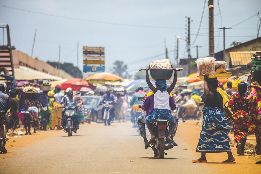 West African market scene. Photograph by Peeterv