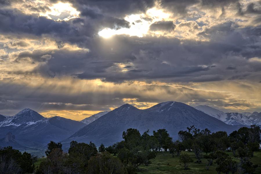 West Elk Mountain Sunbeams Photograph by Eric Rundle