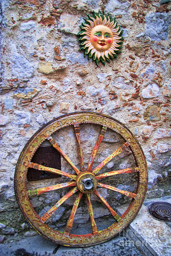 Wheel and Sun in Taormina Sicily Photograph by David Smith