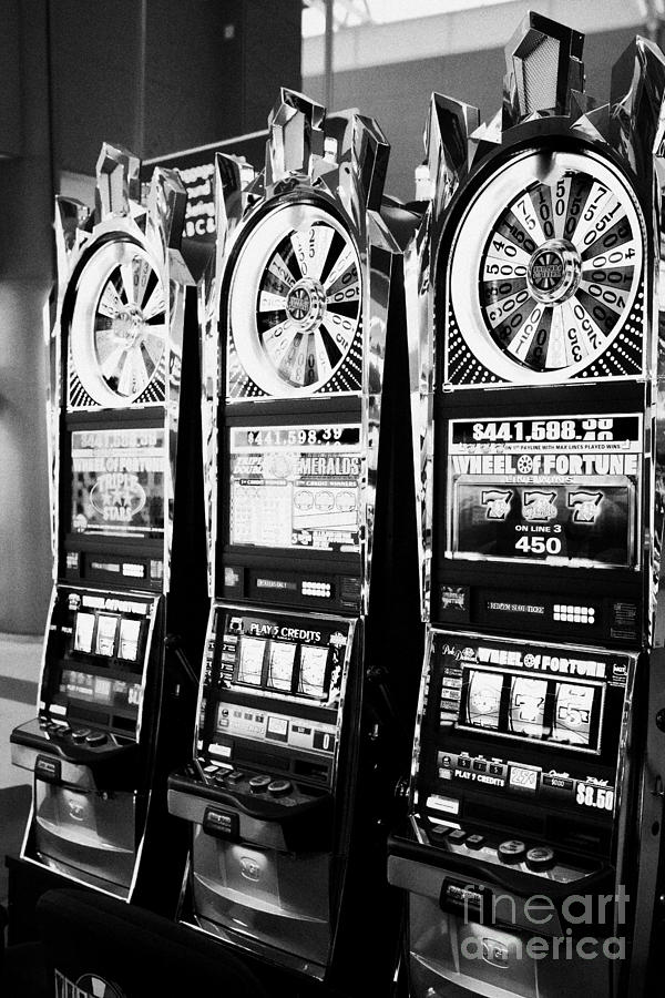 Las Vegas Photograph - wheel of fortune slot gaming gambling machines Las Vegas Nevada USA by Joe Fox