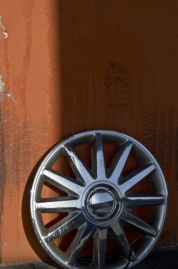 Wheel on Wall Photograph by Kevin Duke
