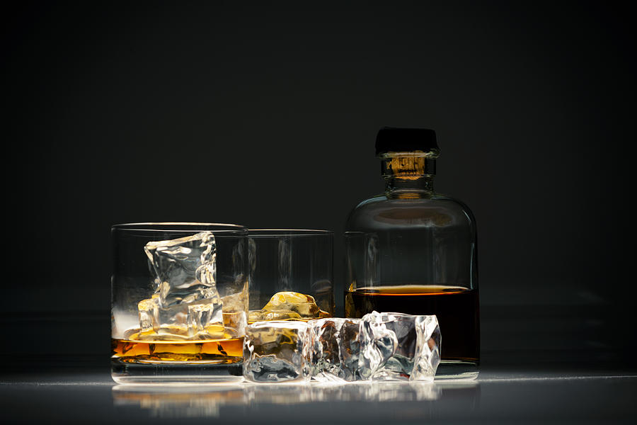 Whiskey in glass with ice Photograph by Subman