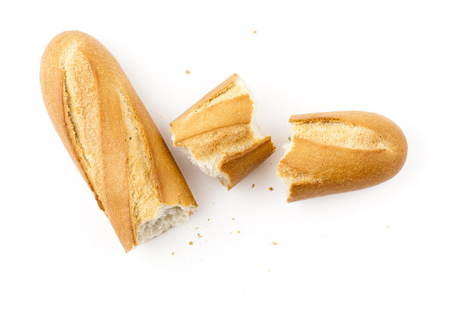 White baguette pieces on a white background Photograph by Gbrundin