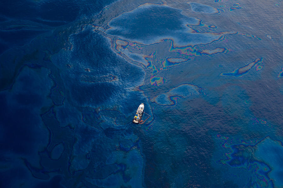 White Boat in Oil Covered Water of Gulf of Mexico Photograph by Photographer Kris Krüg