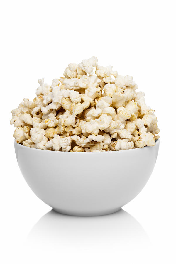 White ceramic bowl full of popcorn Photograph by Creative Crop